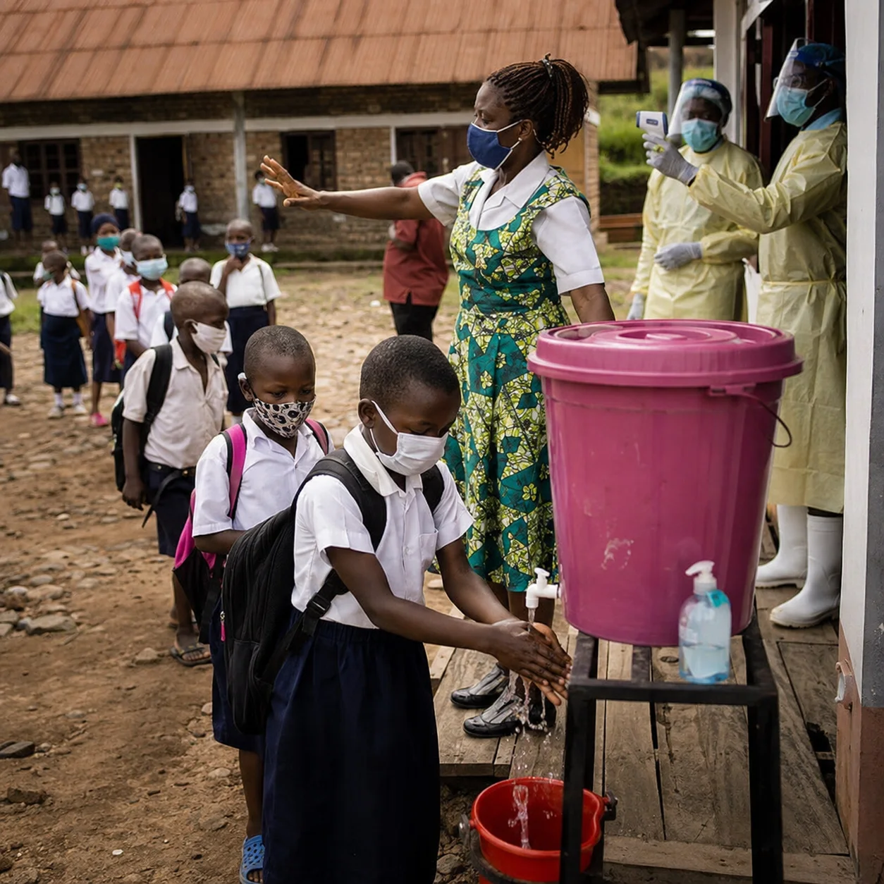 A crowded Ebola treatment center in a rural village, depicting medical workers and patients